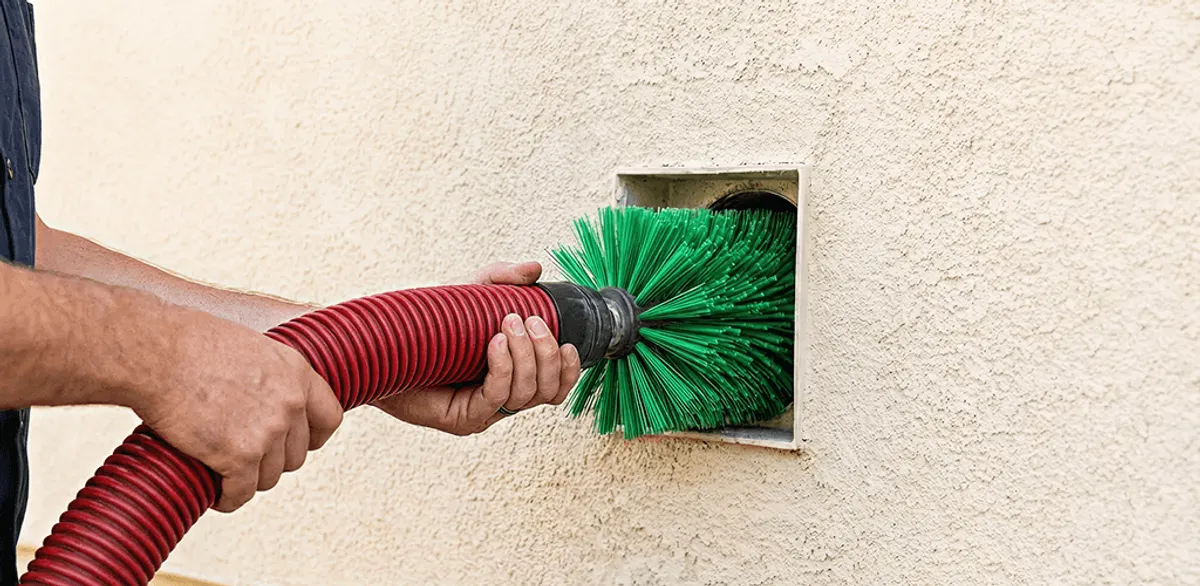 Air duct cleaning brush removing debris from a vent opening in New Orleans, LA