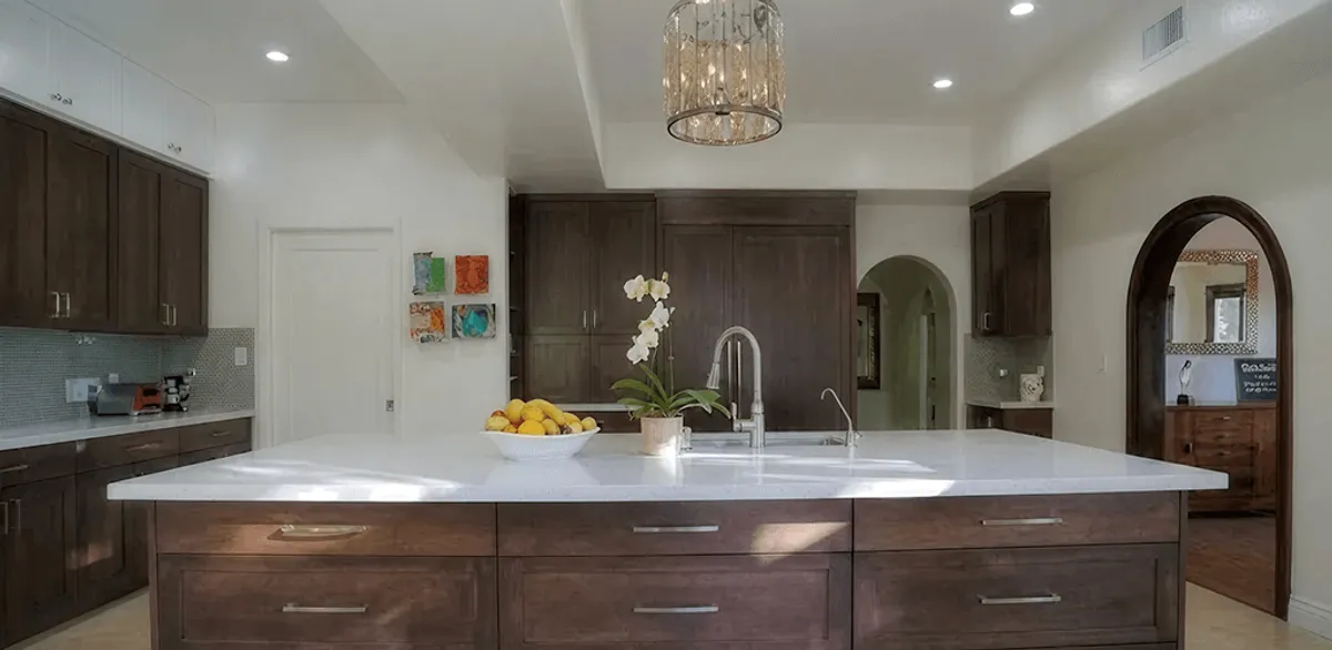 Cabinet refacing project with updated kitchen cabinets and island in New Orleans, LA